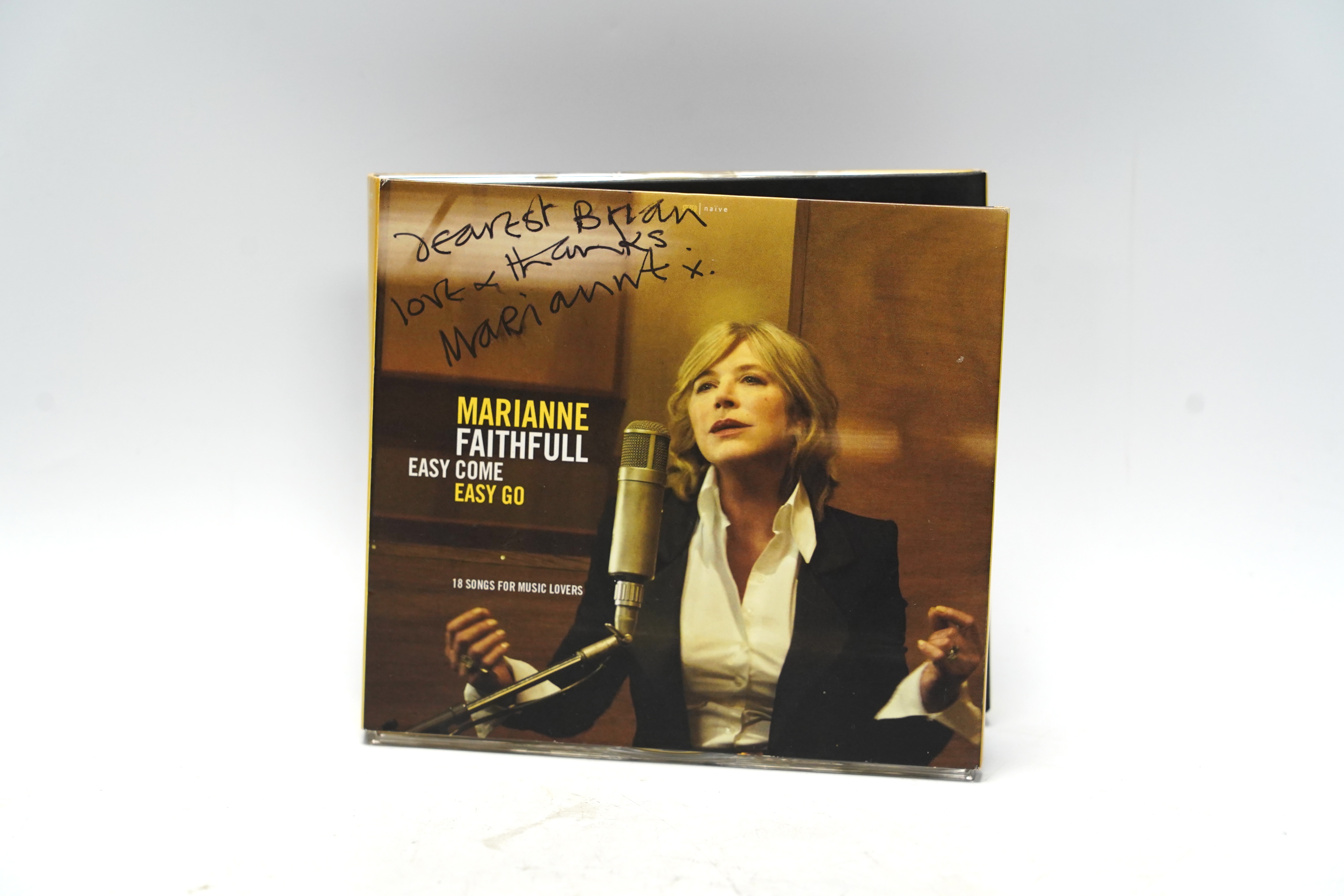 A Marianne Faithful autographed CD; ‘Easy Come Easy Go’ with dedication to the front cover to Brian Matthew, together with a late 1960s black and white press photograph of her in a BBC studio, credited to Axel Poignant t